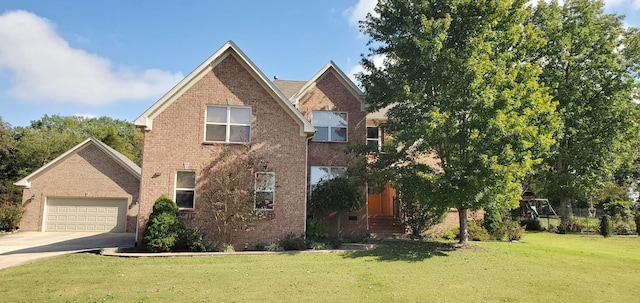 view of front of property featuring a garage and a front yard