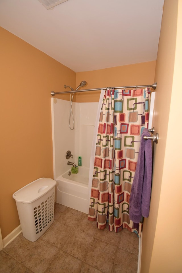 bathroom featuring shower / tub combo and tile patterned floors