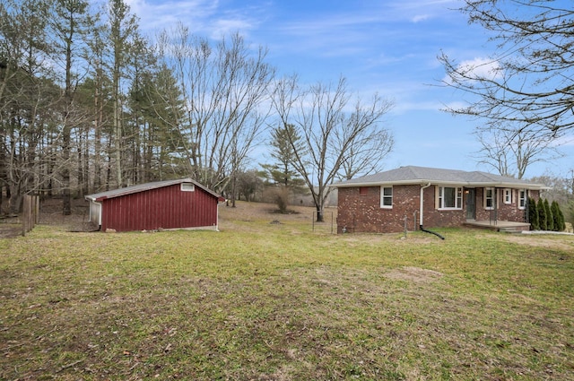 view of yard featuring a storage unit