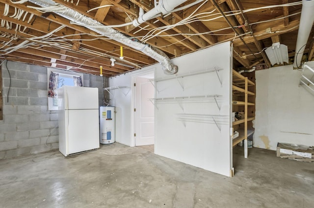 basement featuring water heater and white fridge