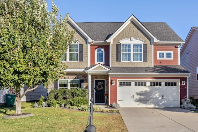 view of front of house featuring a garage and a front lawn