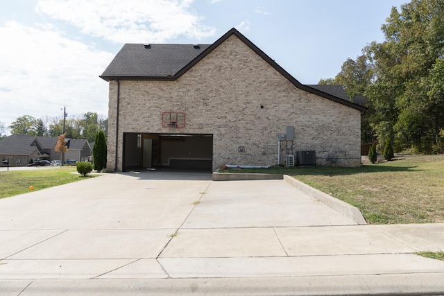 view of side of home with a lawn