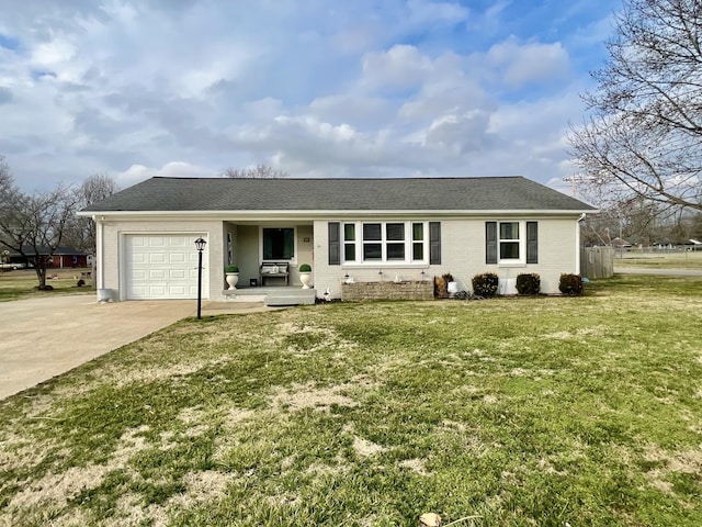 ranch-style home featuring a garage, covered porch, and a front lawn