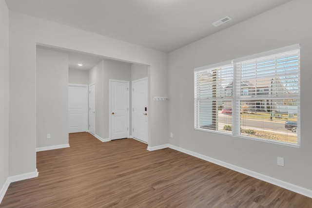 unfurnished room featuring hardwood / wood-style floors