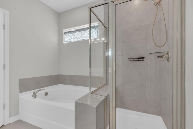 bathroom with separate shower and tub