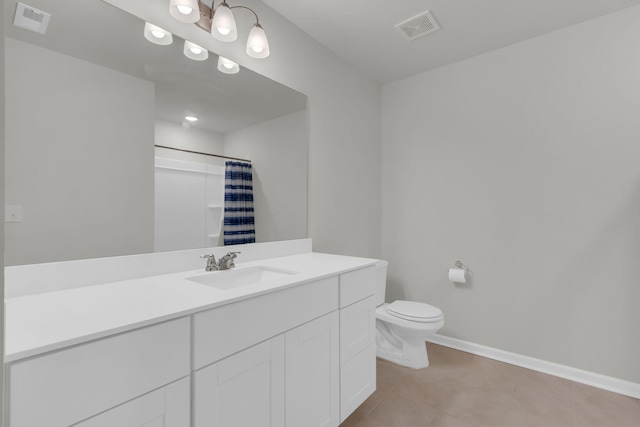 bathroom featuring vanity, curtained shower, tile patterned floors, and toilet