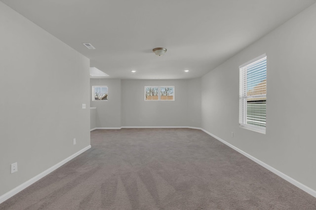 empty room with light colored carpet