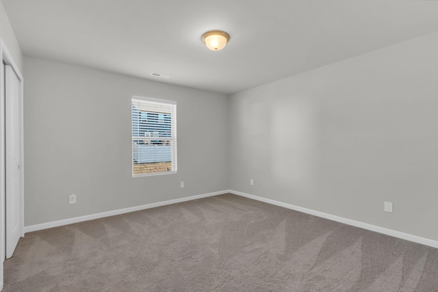 unfurnished room with carpet