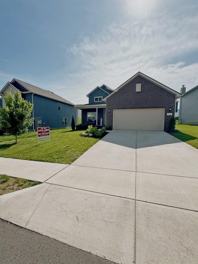 3280 Holiday Ln, Columbia, TN 38401 - view of front facade featuring brick siding, a front yard, concrete driveway, and an attached garage
