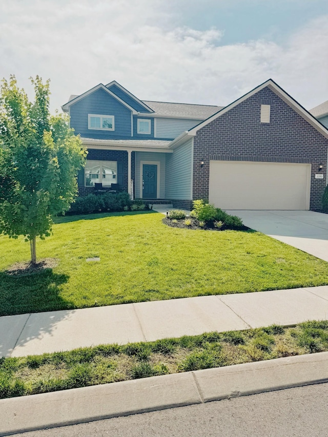 3280 Holiday Ln, Columbia, TN 38401 - view of front of house with brick siding, an attached garage, driveway, and a front lawn