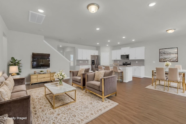 3280 Holiday Ln, Columbia, TN 38401 - living room featuring wood finished floors and recessed lighting