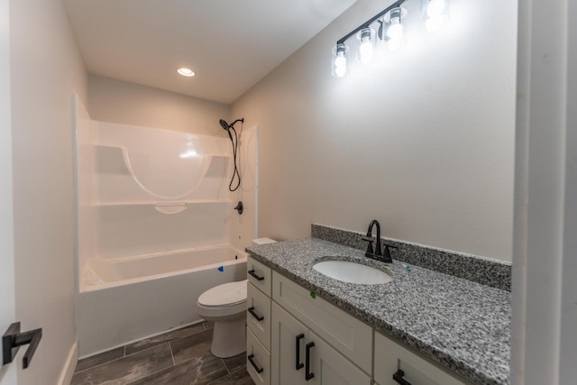 full bathroom with shower / tub combination, vanity, and toilet