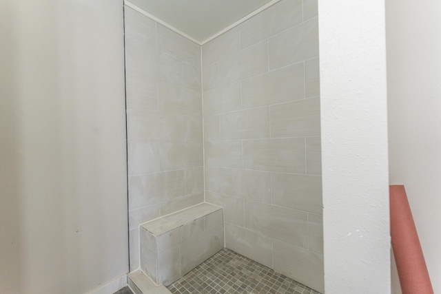 bathroom with tiled shower