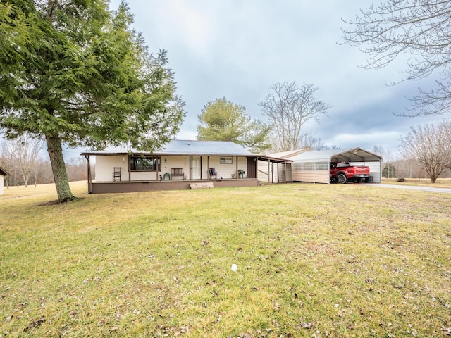 ranch-style house featuring a carport, a front yard, and covered porch