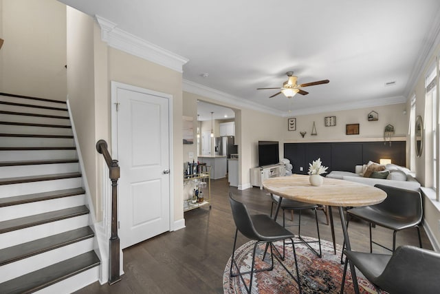 dining room featuring crown molding, dark hardwood / wood-style floors, and ceiling fan