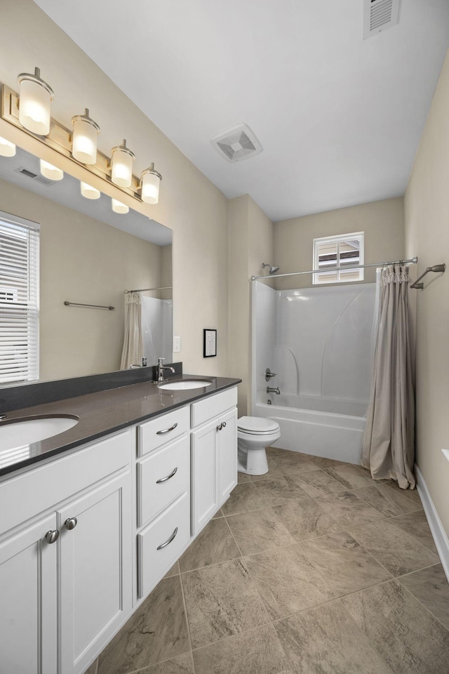 full bathroom featuring vanity, shower / bath combination with curtain, and toilet