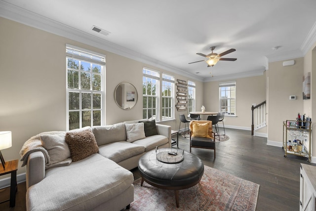 living room featuring crown molding, dark hardwood / wood-style floors, and ceiling fan