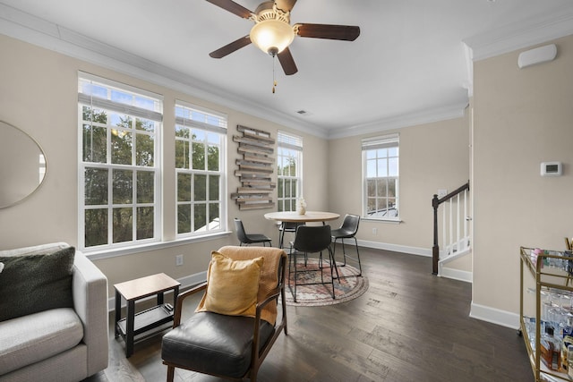 sitting room with crown molding, dark hardwood / wood-style floors, and ceiling fan