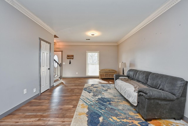 living room featuring dark wood-type flooring and ornamental molding