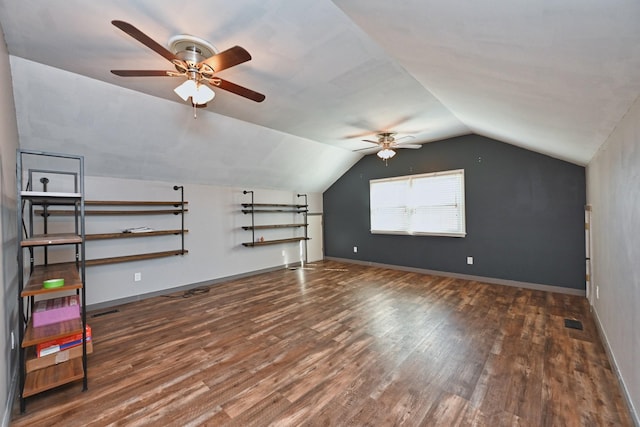 bonus room with ceiling fan, lofted ceiling, and dark hardwood / wood-style floors