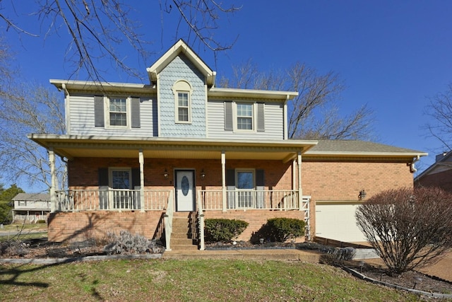 view of front of home with a garage and a porch