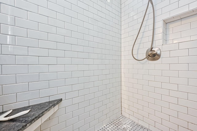 bathroom with tiled shower