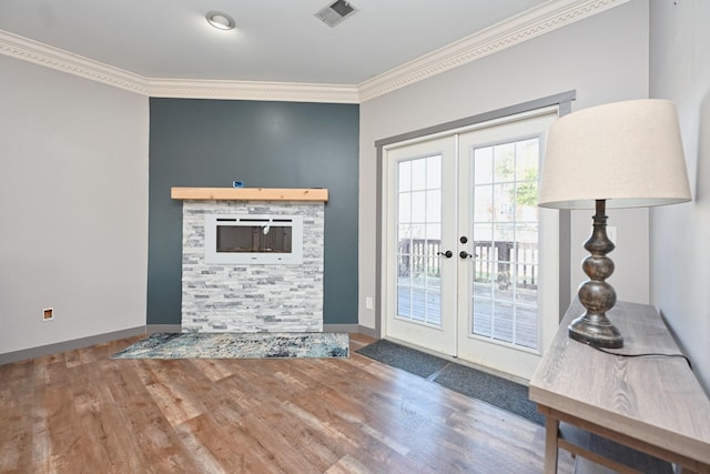 doorway to outside featuring french doors, ornamental molding, and hardwood / wood-style floors