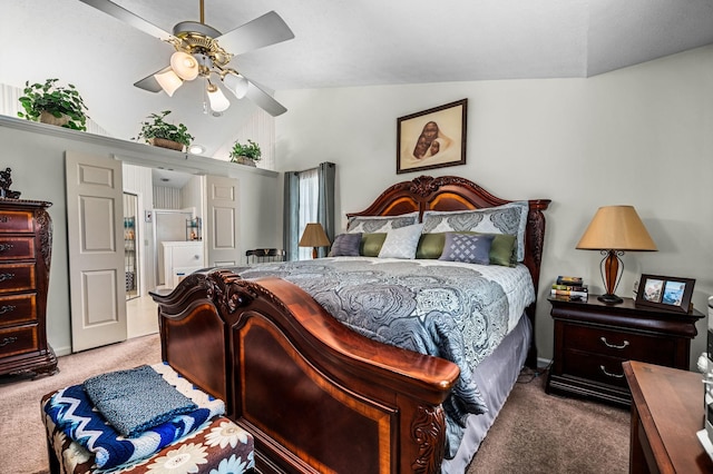 carpeted bedroom featuring lofted ceiling and ceiling fan