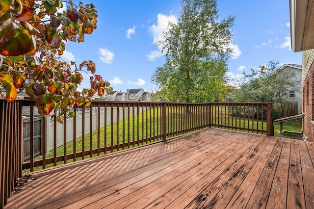 wooden deck with a yard