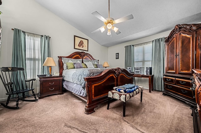 bedroom featuring ceiling fan, lofted ceiling, and light carpet