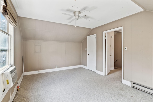 additional living space featuring lofted ceiling, cooling unit, a baseboard heating unit, ceiling fan, and light carpet