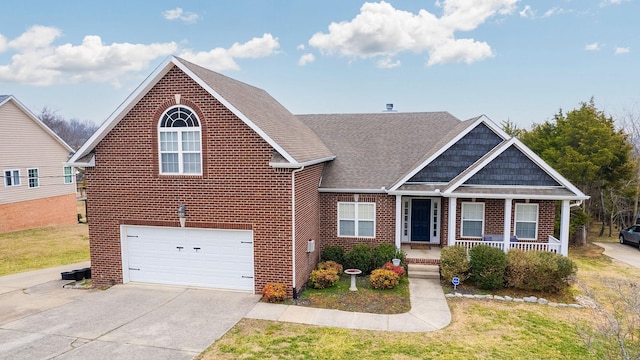 view of front of home featuring a garage, a front yard, and a porch