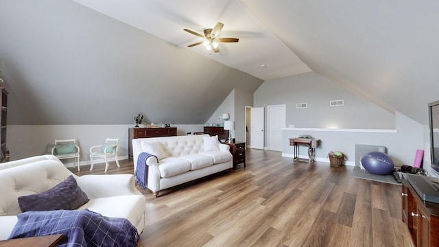 living room featuring lofted ceiling, hardwood / wood-style flooring, and ceiling fan