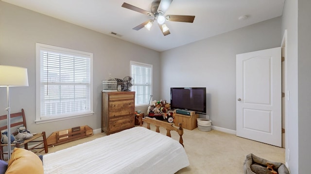 carpeted bedroom with ceiling fan