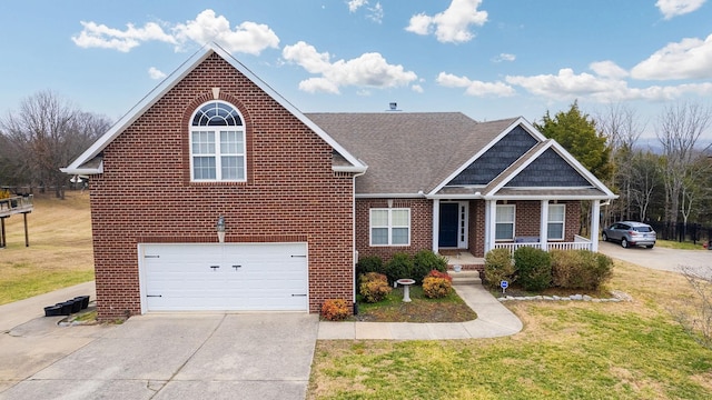 view of front of property featuring a garage, a front yard, and a porch