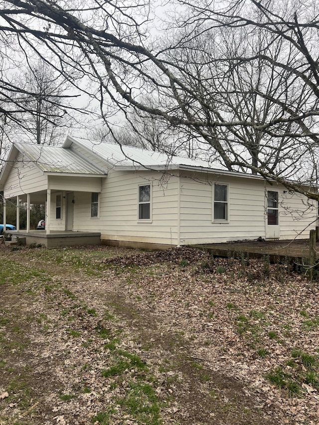 view of side of property with a patio