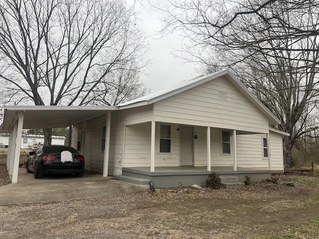 view of front of house featuring a carport and covered porch