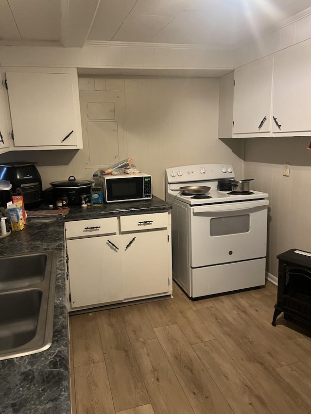 kitchen featuring sink, light hardwood / wood-style floors, white cabinets, and white range with electric cooktop