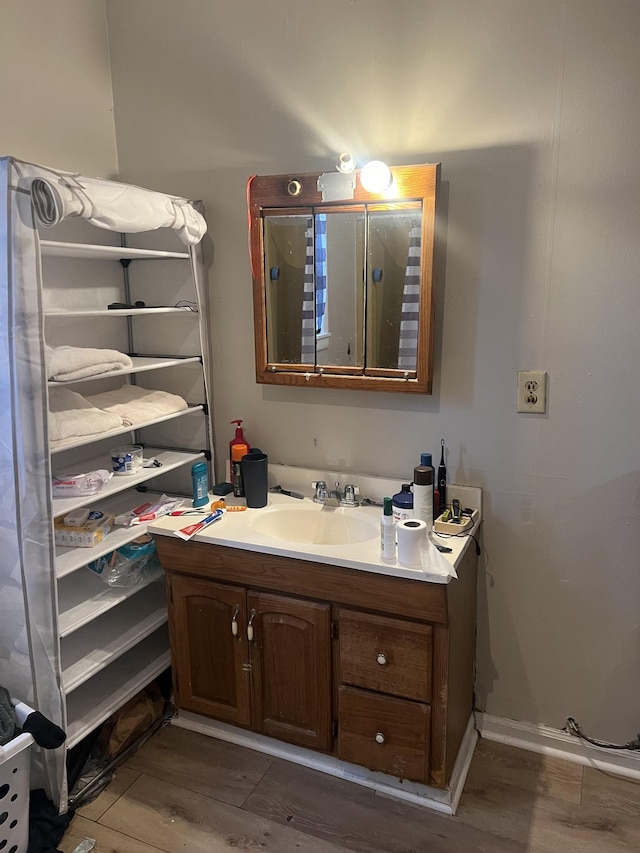 bathroom featuring vanity and hardwood / wood-style floors