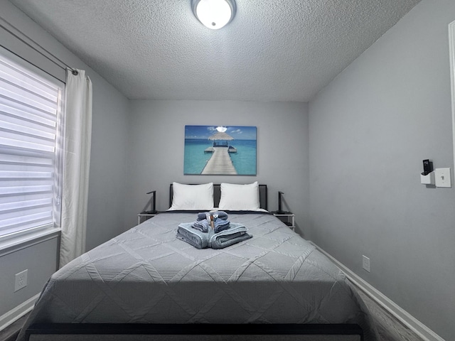 bedroom featuring a textured ceiling