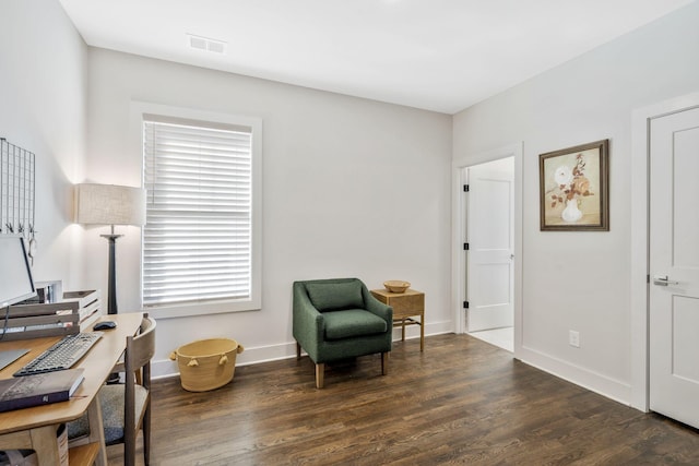 sitting room featuring dark wood-type flooring