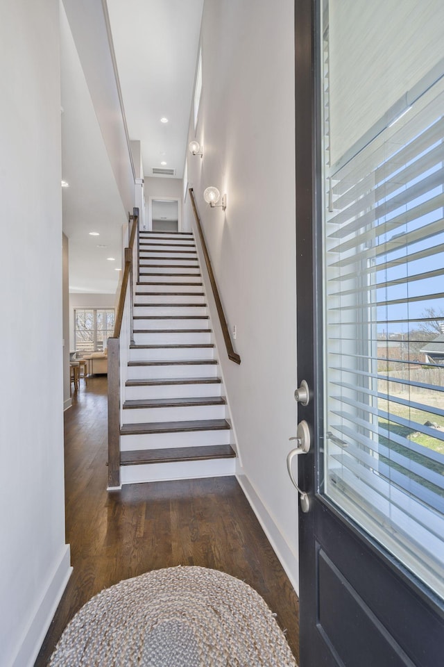 foyer entrance featuring dark wood-type flooring