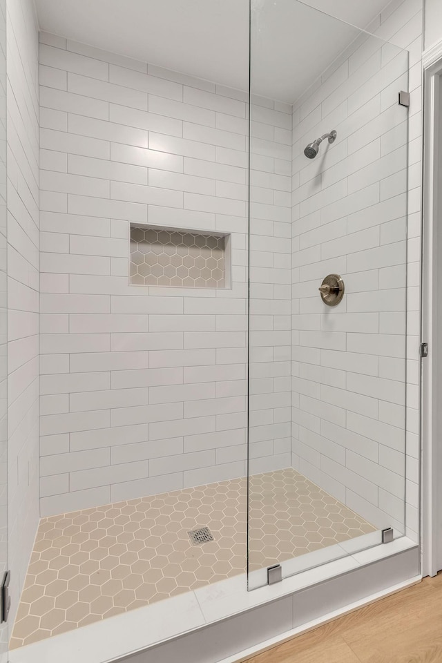 bathroom with tiled shower