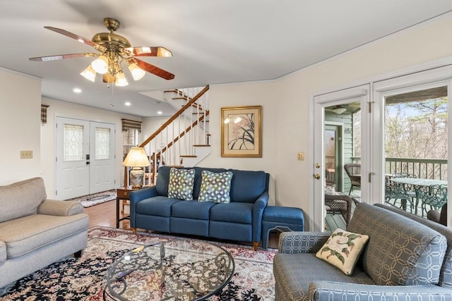 living room featuring ceiling fan and wood-type flooring