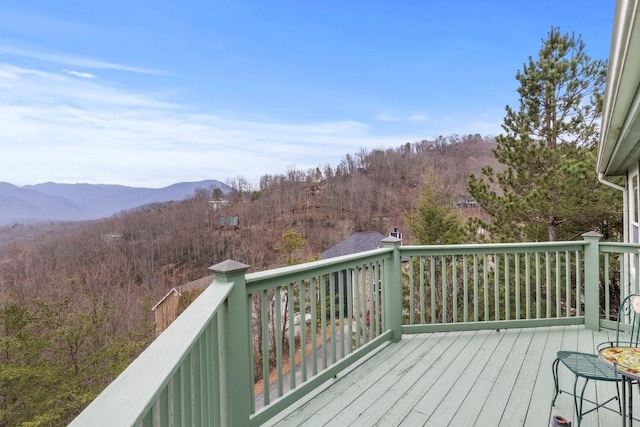 wooden terrace with a mountain view