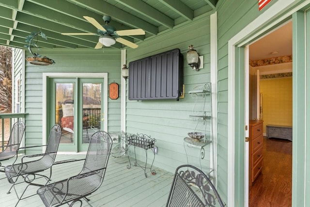 deck featuring ceiling fan and a porch