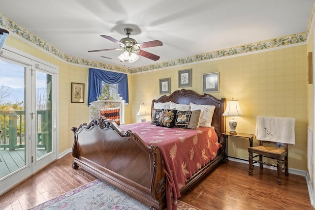 bedroom with ceiling fan, wood-type flooring, and access to outside