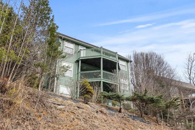 rear view of property with a balcony