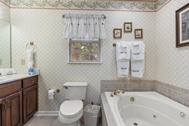 bathroom featuring tile patterned floors, toilet, vanity, and a tub