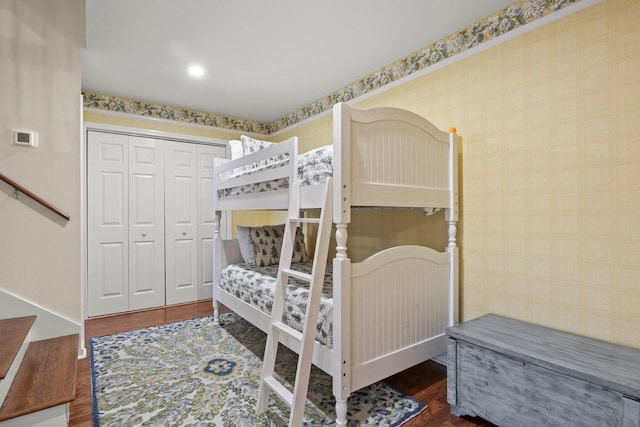 bedroom with dark hardwood / wood-style floors